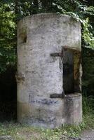 Osowka, Gluszyca, Poland - August 06th, 2024 - Concrete guard booth at entrance to underground tunnels photo