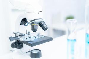 analyze biochemical samples in advanced scientific laboratory. Medical professional use microscope look microbiological developmental of viral. Biotechnology research in science lab. photo
