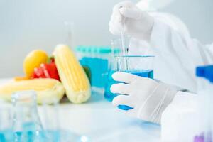 Scientist check chemical food residues in laboratory. Control experts inspect quality of vegetables vegetables. lab, hazards, find prohibited substances, contaminate, Microscope, Microbiologist photo