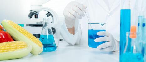 Scientist check chemical food residues in laboratory. Control experts inspect quality of fruits, vegetables. lab, hazards, ROHs, find prohibited substances, contaminate, Microscope, Microbiologist photo