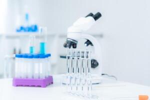 analyze biochemical samples in advanced scientific laboratory. Medical professional use microscope look microbiological developmental of viral. Biotechnology research in science lab. photo