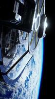 Cargo spaceship on orbit of planet Earth, vertical video