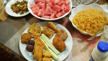 A table with many plates of food and drinks video