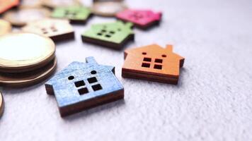 Small wooden house shaped pins on a table video