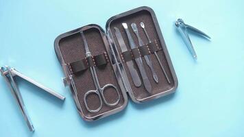 A set of tools in a case on a blue surface video