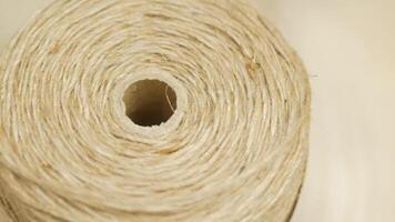 A roll of jute twine on a white background video