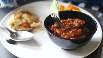 A plate with a fork and a bowl of food video