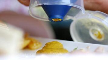 Enhancing Your Meals by Drizzling Delicious Sauce Using an Squeeze Bottle video
