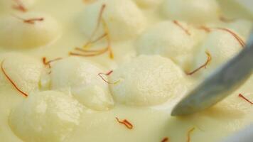 close up of indian sweet in a bowl on table. video