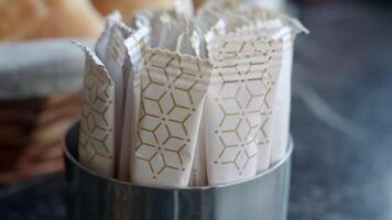 white sugar in a paper packet on table video