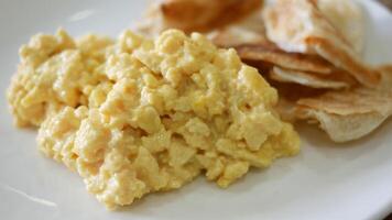 A plate with scrambled eggs and chips video