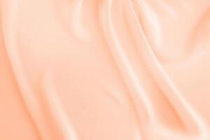 Elegant Peach Fuzz Silk Fabric with Soft Pleats - Ideal for Designer Text Mockups, Luxury Cards, and Retro Backgrounds photo