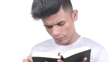 A man is reading a book while looking down video