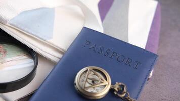 A passport, a pocket watch and a camera video