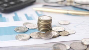 Stacks of coins and calculator on financial report stock photo video