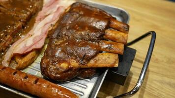 A tray with meat, sausages and bacon on it video
