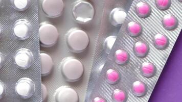 A close up of three different types of pills video