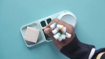 A person holding a toothbrush and toothpaste in front of a tray video