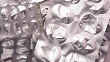 A pile of pills in a plastic container video