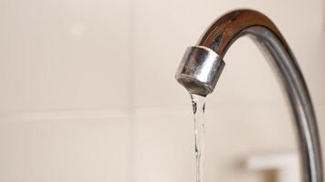 A faucet with water running from it video