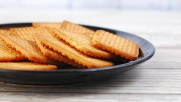 A bowl of biscuits on a wooden table video