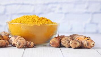 Tumeric and turmeric powder in a bowl video
