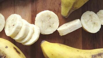 Several bananas are sliced and arranged on a cutting board video