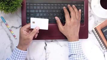 A person is using a credit card to pay for something video