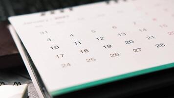Calendar on desk with pen and notebook video