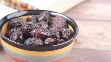Dates in a bowl on a table video