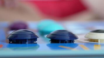 A close up of a board game with buttons video