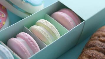 A box with several pastries in it video