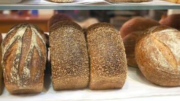 A display of breads in a bakery video