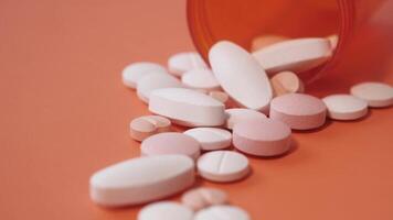 Pills spilling out of an open prescription bottle video