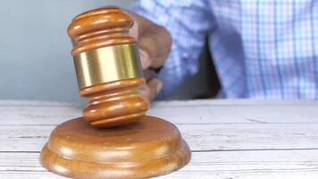A judge's gavel on a wooden table video