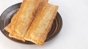 Three pieces of pastry on a plate video