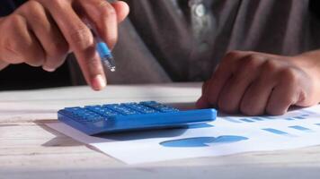 A person is using a calculator to make a graph video