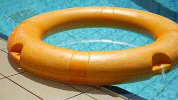A pool with a life ring floating in it video