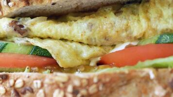A close up of a sandwich with vegetables and eggs video
