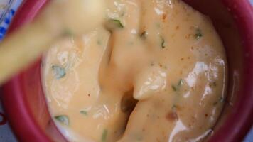 A creamy dip infused with fresh herbs and spices, enhancing your snacking experience video