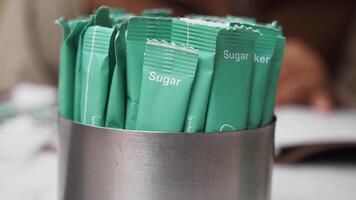 white sugar in a paper packet on table video