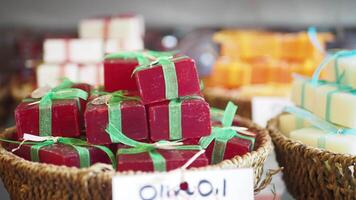 A stack of soaps with colorful ribbons in a basket video