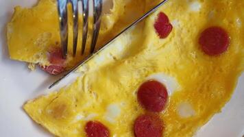 Egg Omelette with sausage on table video