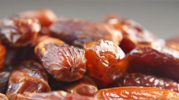 close up of rotating fresh date fruit in a bowl on table video