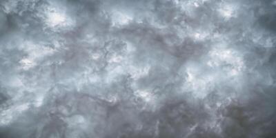 Dramatic cloudscape moody gray storm clouds in a turbulent sky photo
