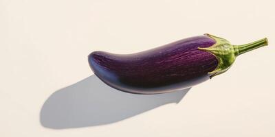 Minimalist composition of a single eggplant with shadow on light background photo