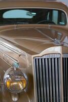 Vintage, shiny car against the background of the night sky. photo
