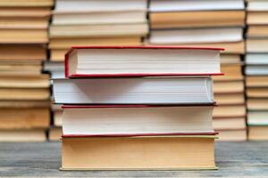 Stack of books in the library. Symbol of knowledge and learning. photo