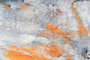 The texture of the stone with various impregnations. photo