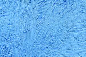 Blue stucco texture. Architectural abstract background. Blue wall of building. photo